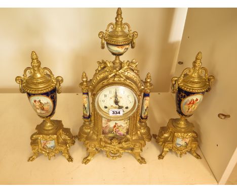 An ormolu clock garniture, the white enamel dial with Arabic numerals, floral sprays to centre above painted panel flanked by