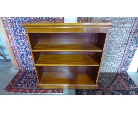 A modern yew reproduction three shelf bookcase - 101cm x 99cm x 32xcm