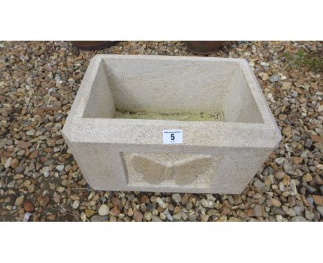A Limestone planter with carved butterfly on front and chamfered sides - Height 25cm x 38cm x 26cm 