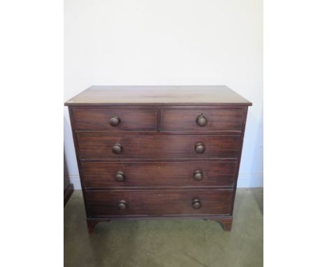 A 19th century mahogany chest with two short over three long drawers on bracket feet - Height 95cm x 105cm x 54cm 