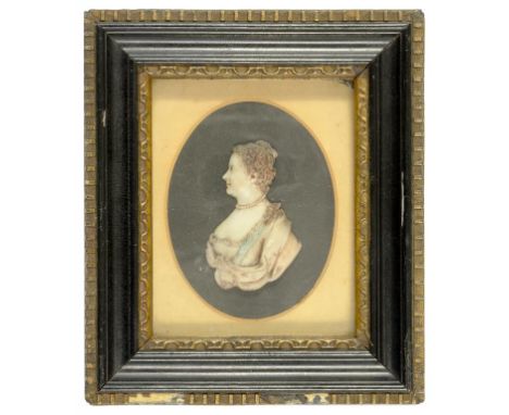 A POLYCHROME WAX PORTRAIT RELIEF OF A LADY, 6.5CM H, 19TH C, IN EBONISED FRAME
