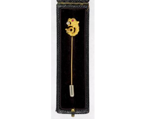 A GOLD STICK PIN, THE TERMINAL CAST AS A GROTESQUE CREATURE WITH RUBY EYE AND A DIAMOND IN IT'S JAWS, 1.8G