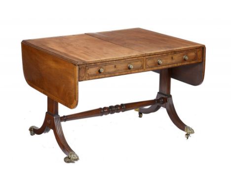 A GEORGE IV MAHOGANY SOFA TABLE,  crossbanded in rosewood and line inlaid, having drum knobs, on reeded outsplayed legs unite