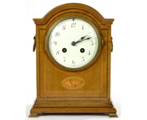 AN INLAID MAHOGANY MANTEL CLOCK, THE BREAKARCHED CASE WITH SHELL PATERA, THE FRENCH GONG STRIKING MOVEMENT WITH ENAMELLED DIA