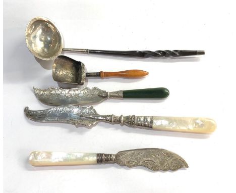 Selection of silver items includes ladle mother of pearl handle butter knives and sugar scoop please see images for details 