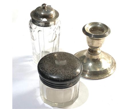 Selection of silver items includes squat candle stick and 2 antique silver top jars they measure approx 7cm dia by 6cm tall t