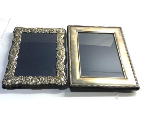 2 Vintage silver picture frames largest measures 20cm by 16cm please see images for details 