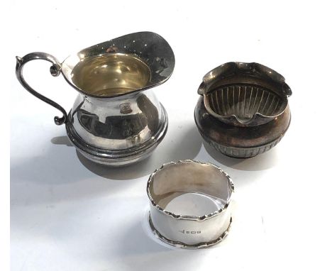 Selection of silver items includes cream jug napkin ring and small bowl 