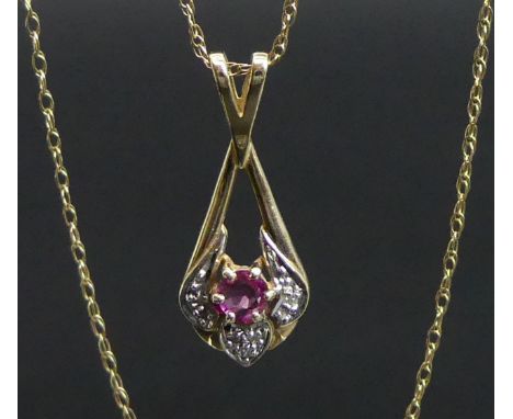 9 carat gold ruby and diamond pendant and 40 cm chain. 1.7 grams. Pendant 25 mm x 10 mm. UK Postage £10 