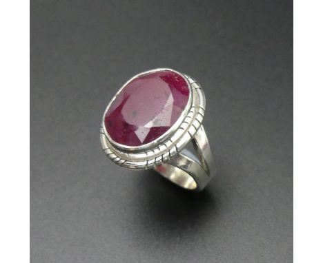 Silver and ruby ring approx. 14 carat. Size N. 20.5 mm top. Band 5 mm. 9.7 grams. UK Postage £12. 