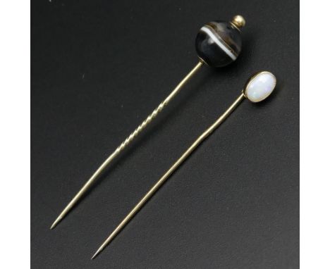 Victorian banded agate stick pin and a similar opal example both in yellow metal. 5.2 grams. 70 mm and 60 mm in length. UK Po
