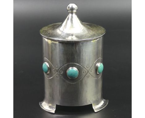 A.E. Jones Edwardian planished silver tea caddy, set with Ruskin type high fired roundels. Birmingham 1903. 125 mm high. 174 