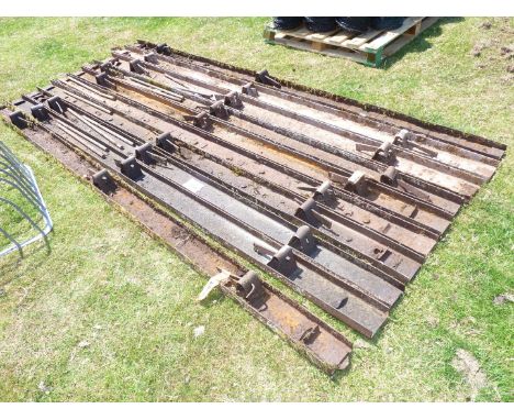 Ten lengths of 10' long x 5'' high steel concrete shuttering with twelve 2' long steel fixing pins.