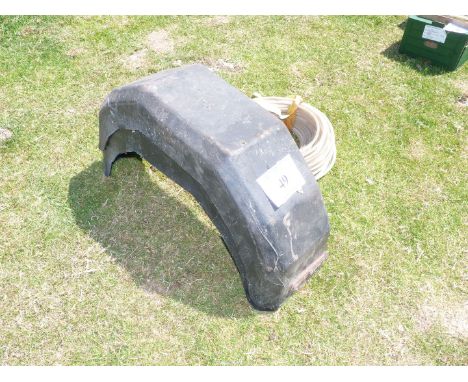A pair of tractor mudguards and plastic pipe (approx 1/4" inside dimensions).