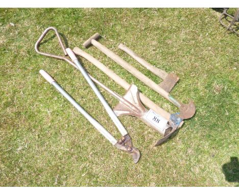 Bulb planter, loppers, small hatchet, etc.