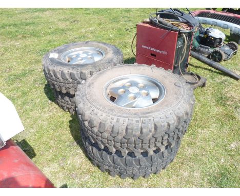 Four Land Rover off-road tyres.