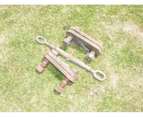 A turn buckle tensioner and a pair of cast iron fish plates/joiners.