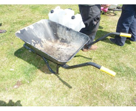 A Wheelbarrow with a solid tyre.