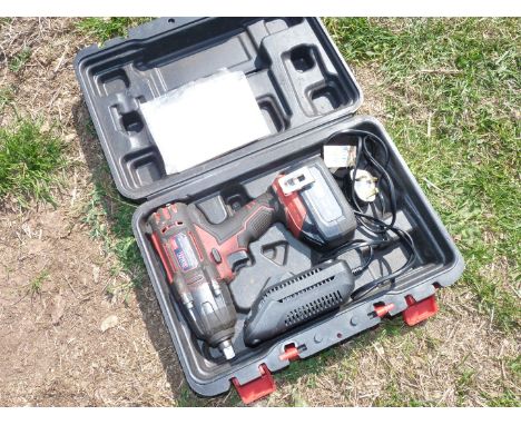 A Sealey 18 volt 1/2" drive cordless impact Wrench with charger and battery.