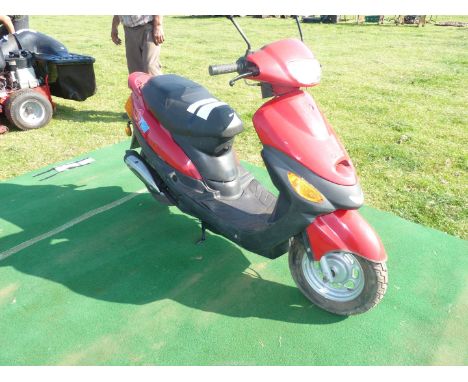A CTM 50QT-7 Moped/Scooter, (needs a new battery), keys in office. Never been used on the road. No documents present.  **As w