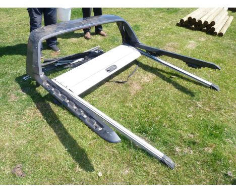 A Ford Ranger pickup truck canopy/cover with roller back.