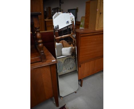 A vintage frameless cheval mirror, and dansette style ebonised legs, height approx 129cm