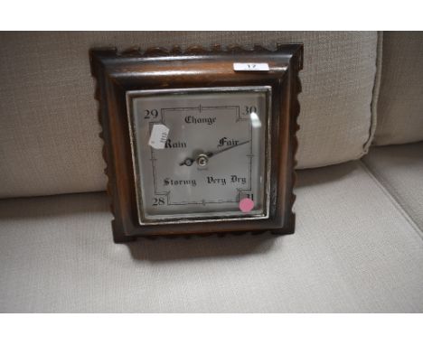A mid 20th Century barometer in square oak case