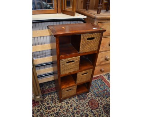 A small hardwood shelf with cane fronted style drawers