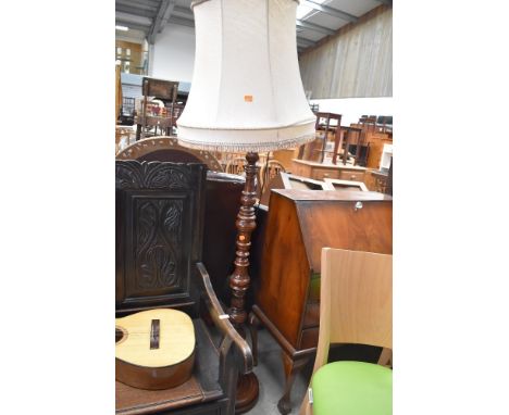 An early 20th Century mahogany standard lamp having turned base and column