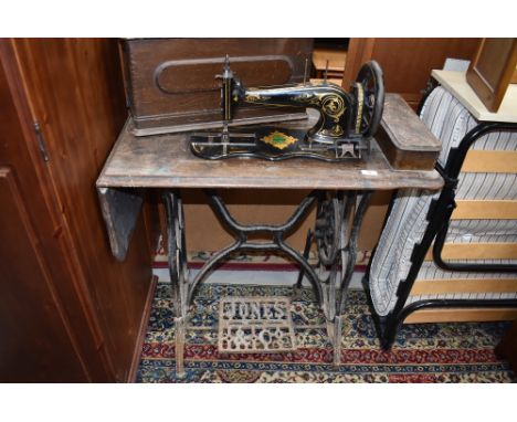 A vintage treadle sewing machine, Jones medium