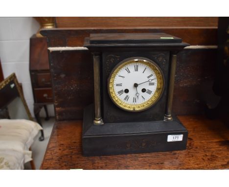 A gothic style Victorian mantle clock having enamel face dial