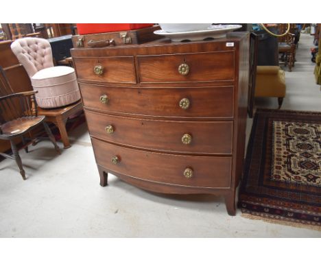 A 19th Century mahogany bow fronted chest of two over three drawers having brass rosette handles