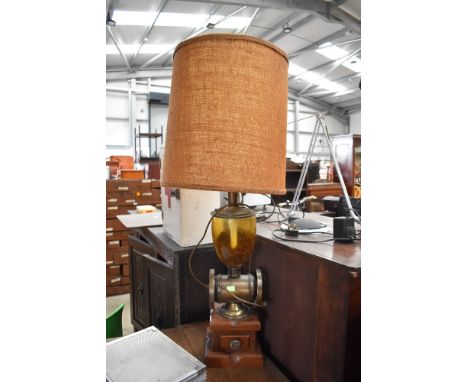 A mid century French styled lamp having coffee grinder base and original shade