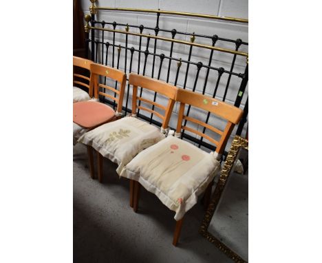 A set of four pine ladder back dining or kitchen chairs