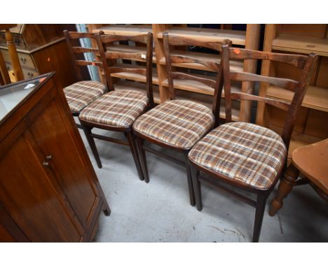 A set of four mid century bent wood dining chairs with arched ladder backs
dimensions approx height 84cm, seat heoght 46cm, w