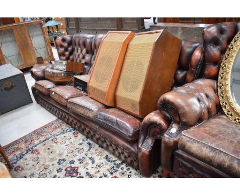 A button back leather four seater settee (no feet) width approx. 235cm.
Speakers not included and are in another sale.