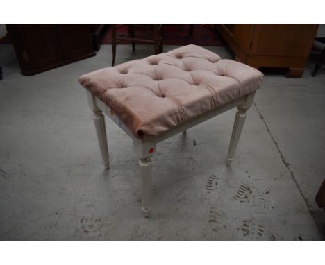 A vintage dressing table stool