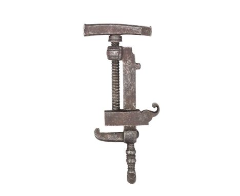 A COMBINED MAINSPRING CLAMP, TURNSCREW, HAMMER AND KNAPPER, PROBABLY 17TH CENTURY  ‡ formed entirely of steel, with slightly 