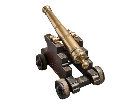 A BRONZE SIGNAL CANNON, 19TH CENTURY  with tapering barrel divided by raised mouldings, plain trunnions, globose cascable wit