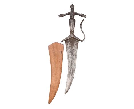 A SOUTH INDIAN DAGGER (CHILANUM), 16TH/17TH CENTURY  with curved double-edged blade formed with a reinforced tip and a low me