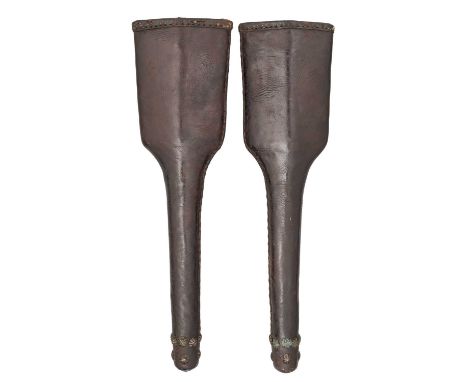 A PAIR OF LONG PISTOL HOLSTERS OF MILITARY TYPE, LATE 17TH/EARLY 18TH CENTURY  ‡ of hardened leather in double thickness, the