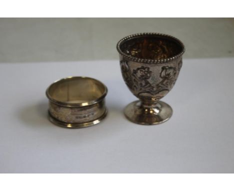 A HALLMARKED SILVER NAPKIN RING and egg cup  (2)