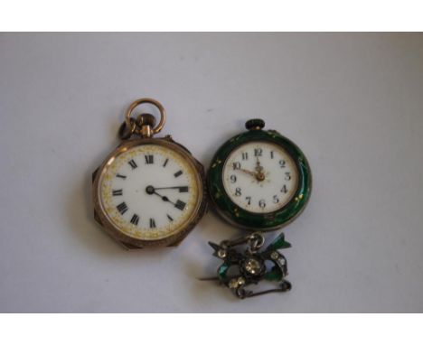 A 9ct GOLD LADIES FOB WATCH WITH ENAMEL DECORATION TO THE BACK (A/F) along with a white metal ladies' fob watch with enamelle