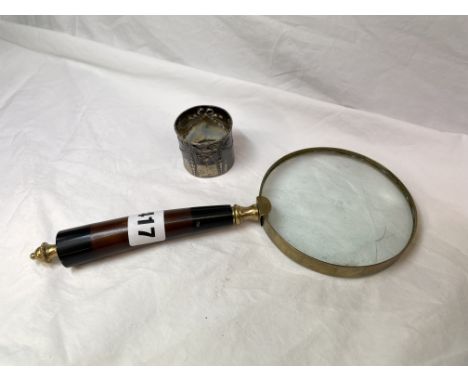 SILVER NAPKIN RING AND A BRASS OVERSIZED MAGNIFYING GLASS 