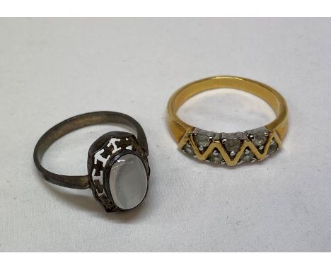 UNMARKED YELLOW METAL CHANNEL SET RING AND A SILVER MOON STONE RING