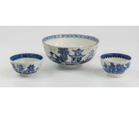 A Lowestoft blue and white porcelain slop bowl, circa 1790, decorated with Chinese pagodas, dia.15cm, together with a similar