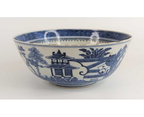 A Chinese export blue and white porcelain bowl, 19th century, decorated with pagodas within a landscape, four character Kangx