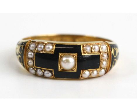 A 18ct gold mourning ring, having black enamel detail and nine seed pearl between 1.72 and 2.8mm in diameter, size Q, gross w