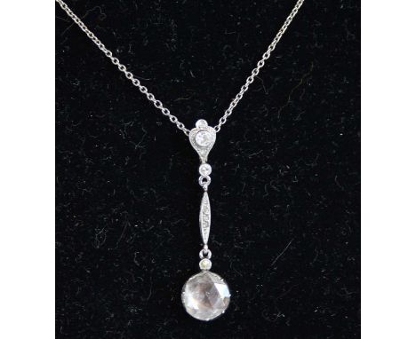 A late Georgian diamond articulated bar pendant, featuring a rose cut diamond in closed foil back setting, suspended below th