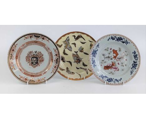 A Chinese export porcelain armorial plate, 18th century, the arms within a floral and diaper border, dia.23cm, together with 